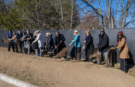 A photo of County Executive Calvin Ball and attendees with shovels in hand breaking ground on the County's new Non-Congregate Shelter in North Laurel.