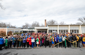 A photo of County Executive Calvin Ball and members of Howard County's Black Greek Letter organizations celebrating the grand reopening.