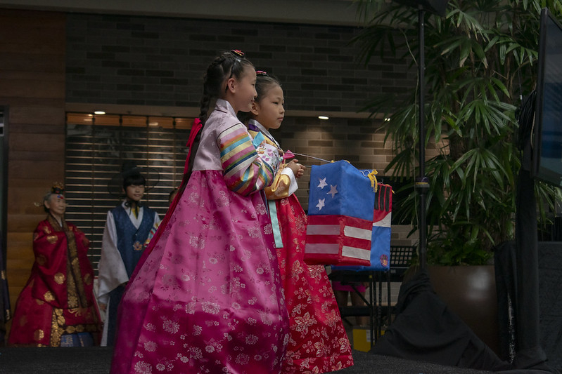 Two young Asian girls dressed in traditional Korean attire