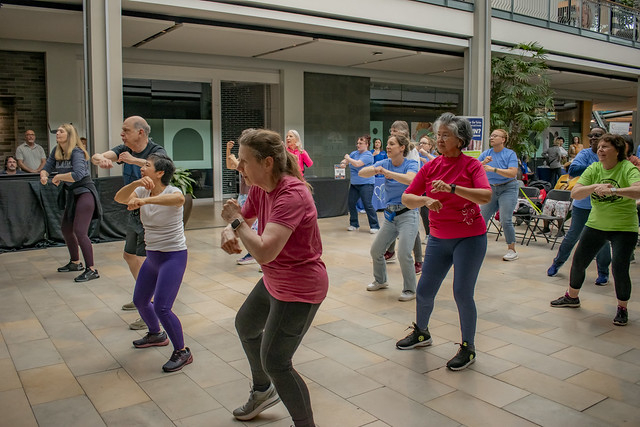 group of 20 people doing zumba