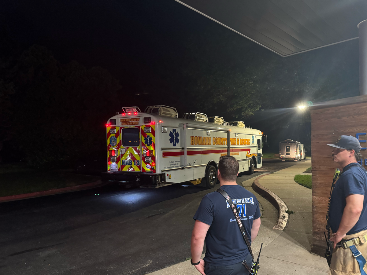 Two firefighters stand by HCDFRS Mobile Ambulance Bus
