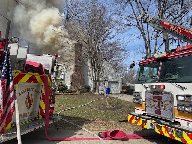 Smoke showing from single family home, fire engines out front