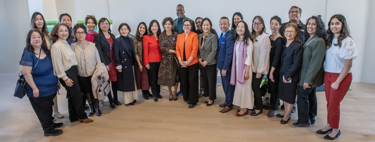 An image of County Executive Calvin Ball and 23 men and women representing the Howard County AAPI Commission and its supporters. 