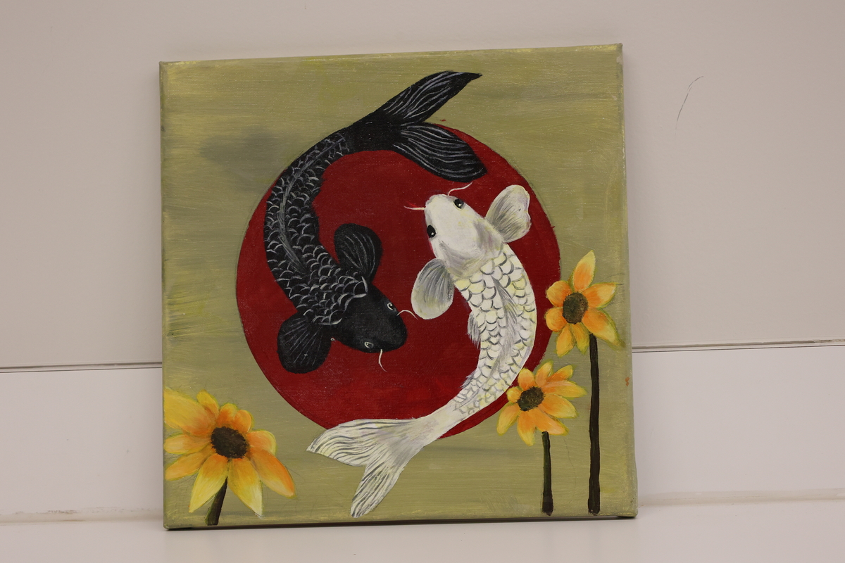 Artwork is of two koi fish, one white and one black representing yin-yang.