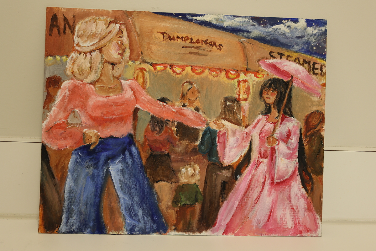 This artwork shows two women enjoying an outdoor festival.