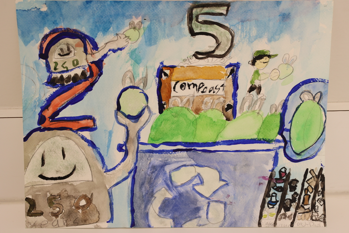 Child's drawing is of a recycling bin and a compost bin.