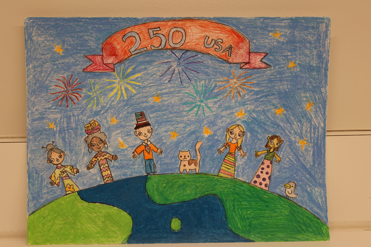 Child's drawing is of a family enjoying fireworks.