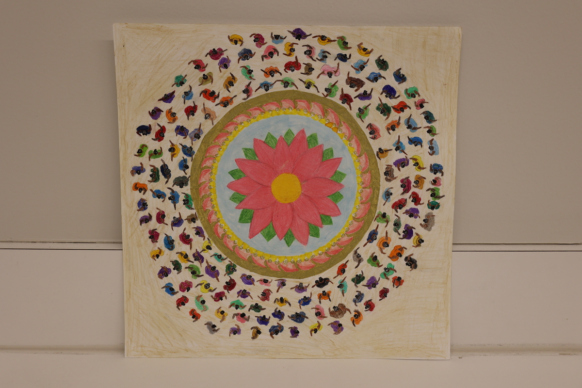 Artwork of a lotus flower in the middle with people dancing around it.