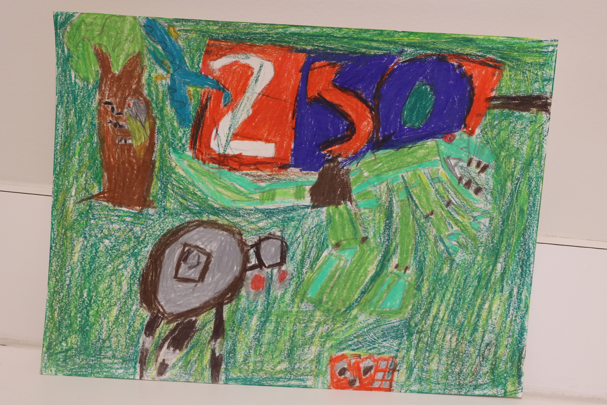 Child's drawing of a garden with a robot and a tree.