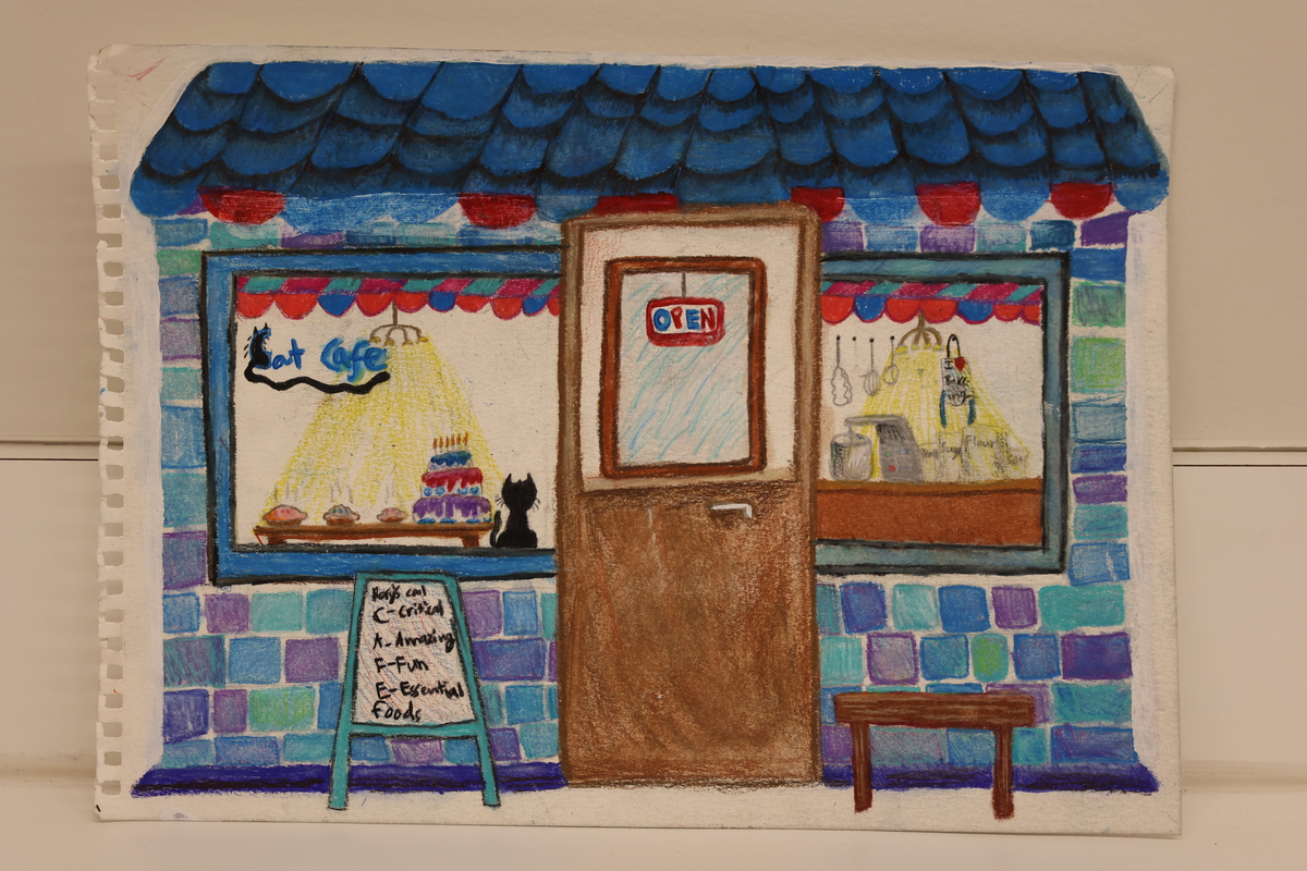 Child's drawing of a cat café, with a cat in the window.