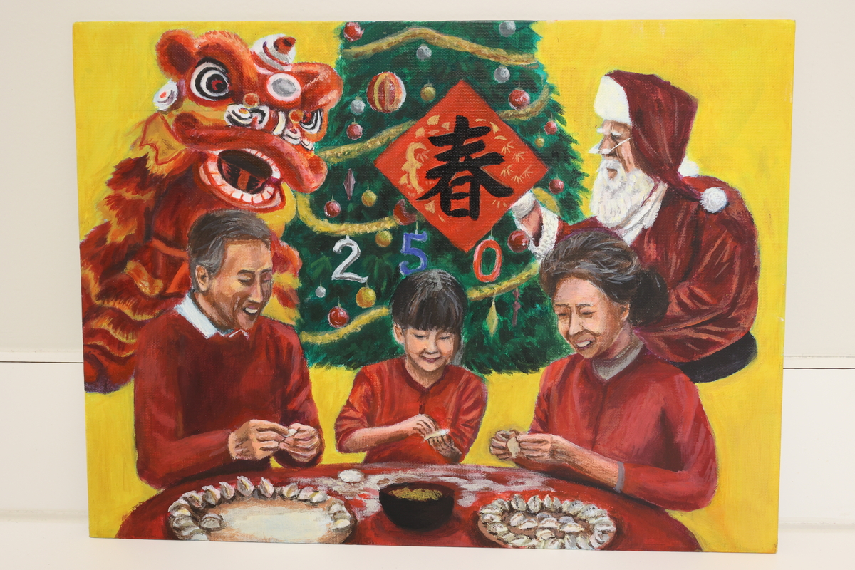 This artwork shows a family celebrating Chinese New Year. They are making dumplings and have a Christmas tree behind them with Santa on one side and a Chinese dragon on the other.