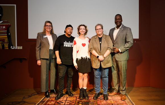 A photo County Executive Calvin Ball and others with Howard County's newest Youth Poet Laureate Penelope Tofigh.