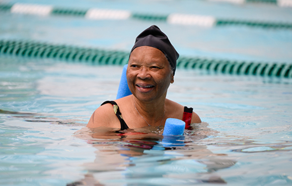 Woman participating in water aerobics activity