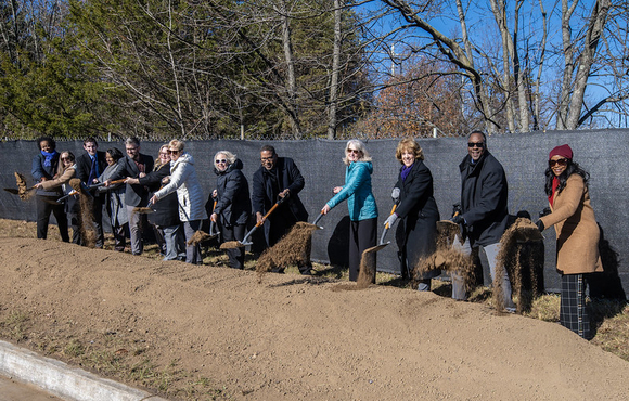 A photo of County Executive Calvin Ball and attendees with shovels in hand breaking ground on the County's new Non-Congregate Shelter in North Laurel.