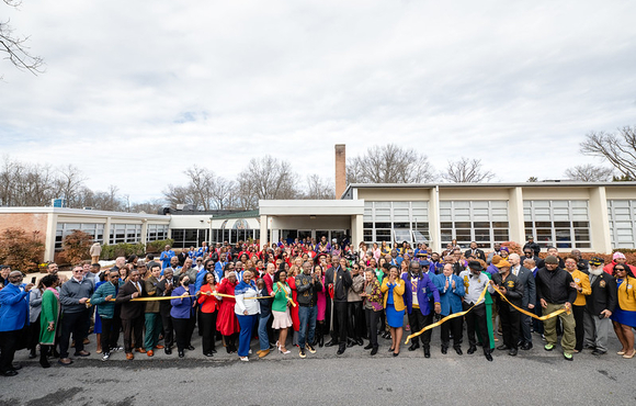 A photo of County Executive Calvin Ball and members of Howard County's Black Greek Letter organizations celebrating the grand reopening.