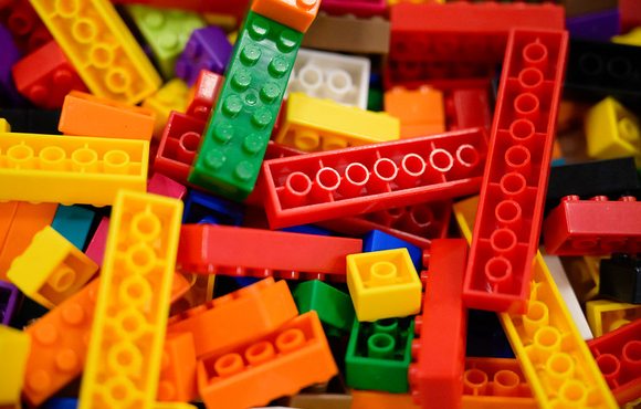 a bucket of colorful LEGO pieces