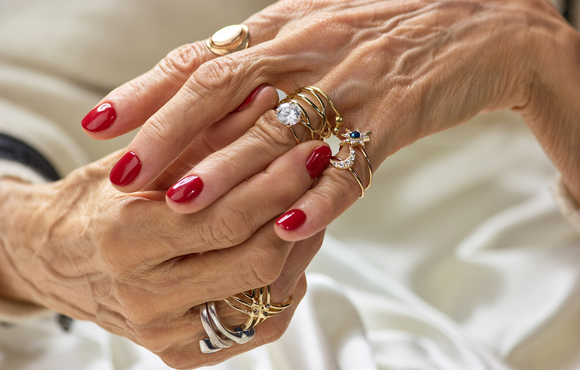 women's hands, gold jewelry