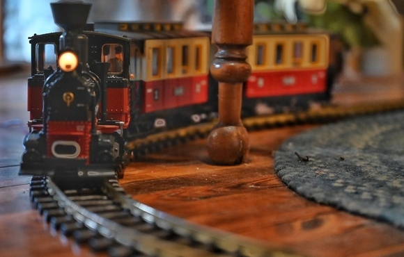A model train passes on the track.