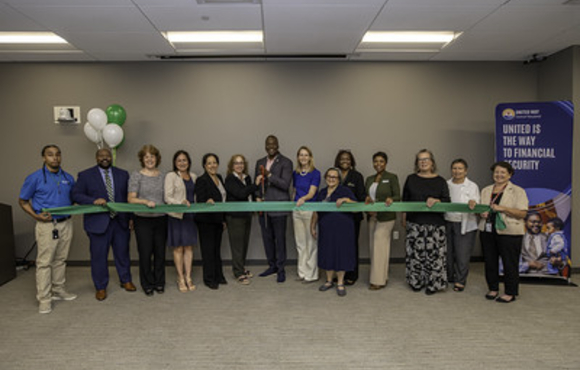 Group of officials at ribbon cutting of Financial Empowerment Center