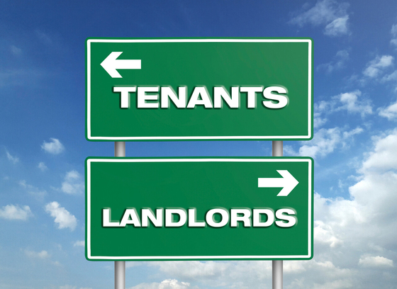 Road signs with arrows and the words tenants and landlord