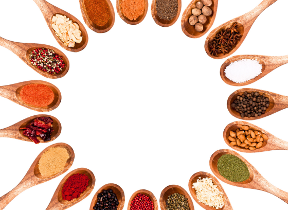 spoons holding a variety of colorful spices