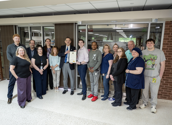 The DILP team is presented with the Building Safety Month Executive Proclamation. 