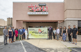 Image of hang ari restaurant with staff and howard county officials 