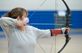 woman shoot bow and arrow