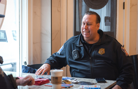 Office sitting at table with coffee