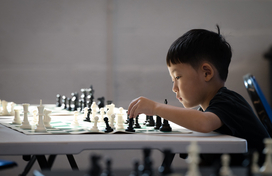 Child playing chess