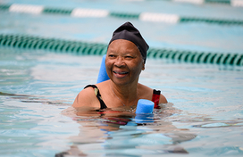Woman participating in water aerobics activity