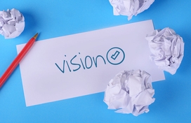 A note with the word vision written on it for vision board