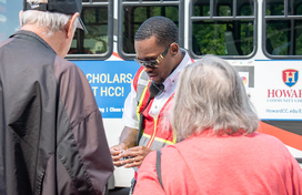 Two older adults talking with an RTA Driver.