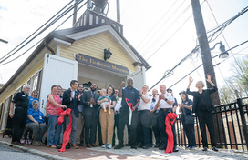 Officials and guests cut the ribbon on renovated Ellicott City Firehouse Museum