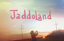 An outdoor sunset with the text 'Jaddoland'