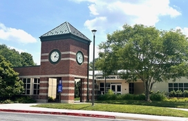 Outside of the Owen Brown Community Center, including the large clock tower