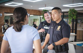 Officers speak with a woman