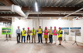 Group of officials at wallbreaking event for Phase 2 of Capitoline Center