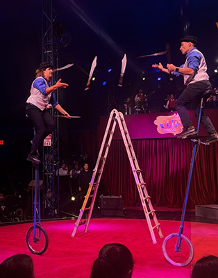 Michael Rosman and son performing on stage