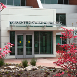 George Howard Building entrance with red dogwood blossoms