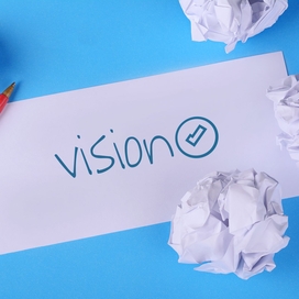 A note with the word vision written on it for vision board