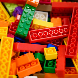 a bucket of colorful LEGO pieces