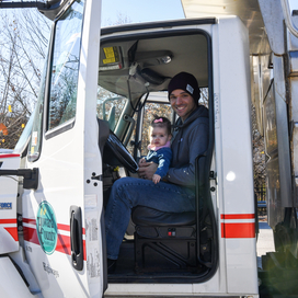 adult with child on lap in highways truck
